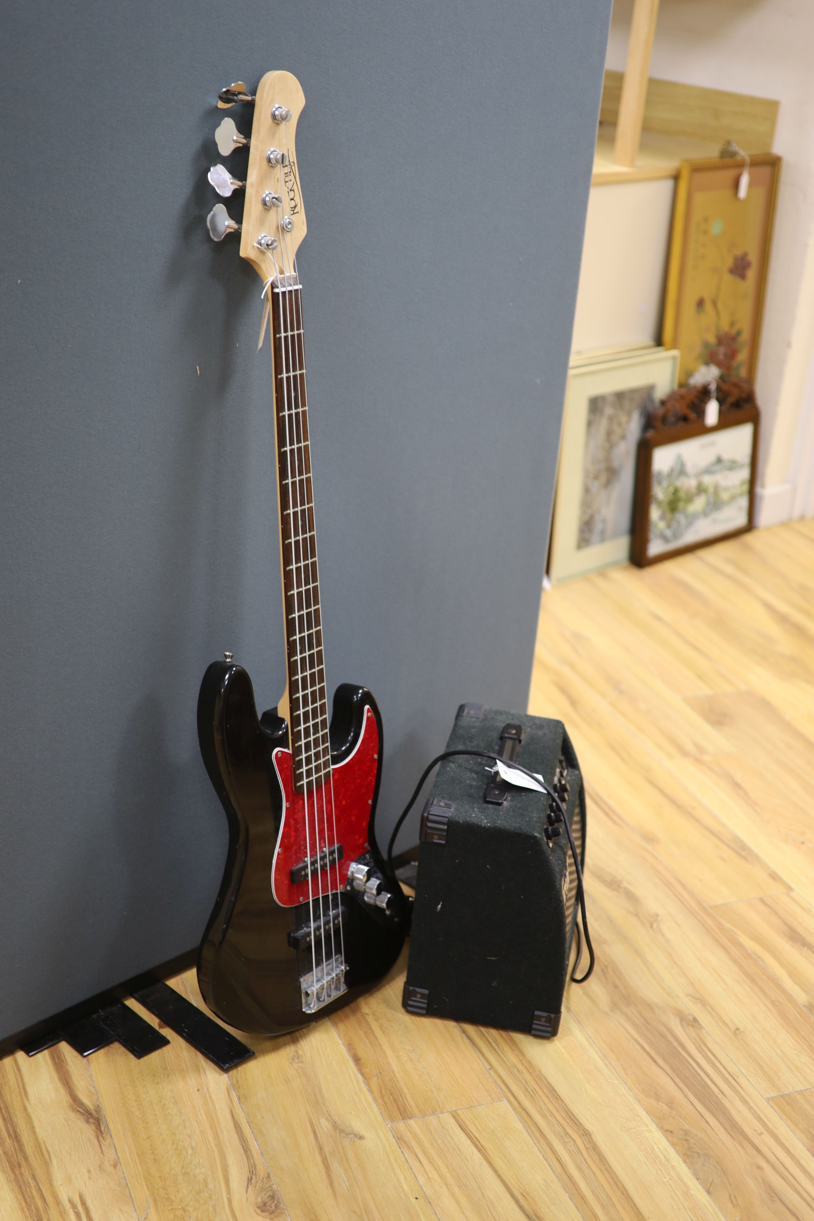 A Rock tile electric base guitar and a Great amplifier
